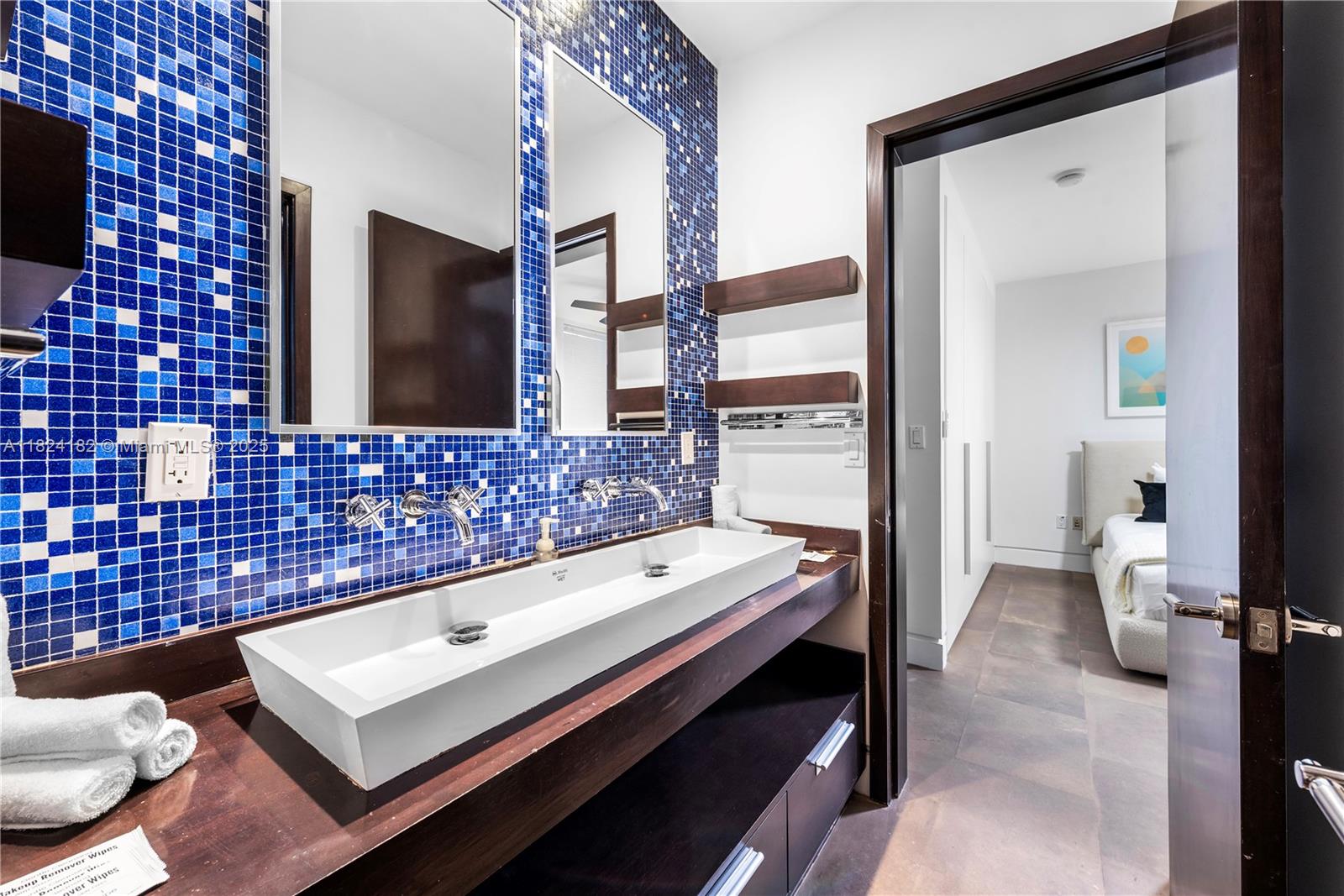 1606 South Bayshore Drive Miami, FL 33133 - Photo 31 of 54 a bathroom with a sink and a mirror