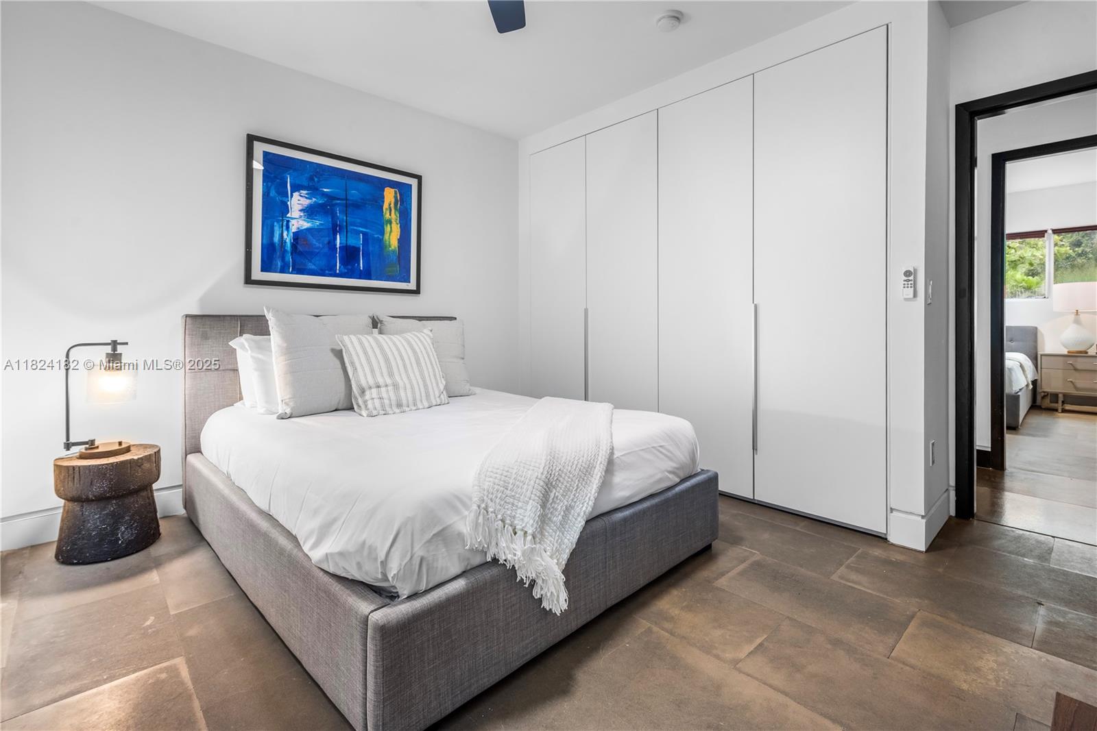 1606 South Bayshore Drive Miami, FL 33133 - Photo 32 of 54 a bedroom with a bed and painting on the wall