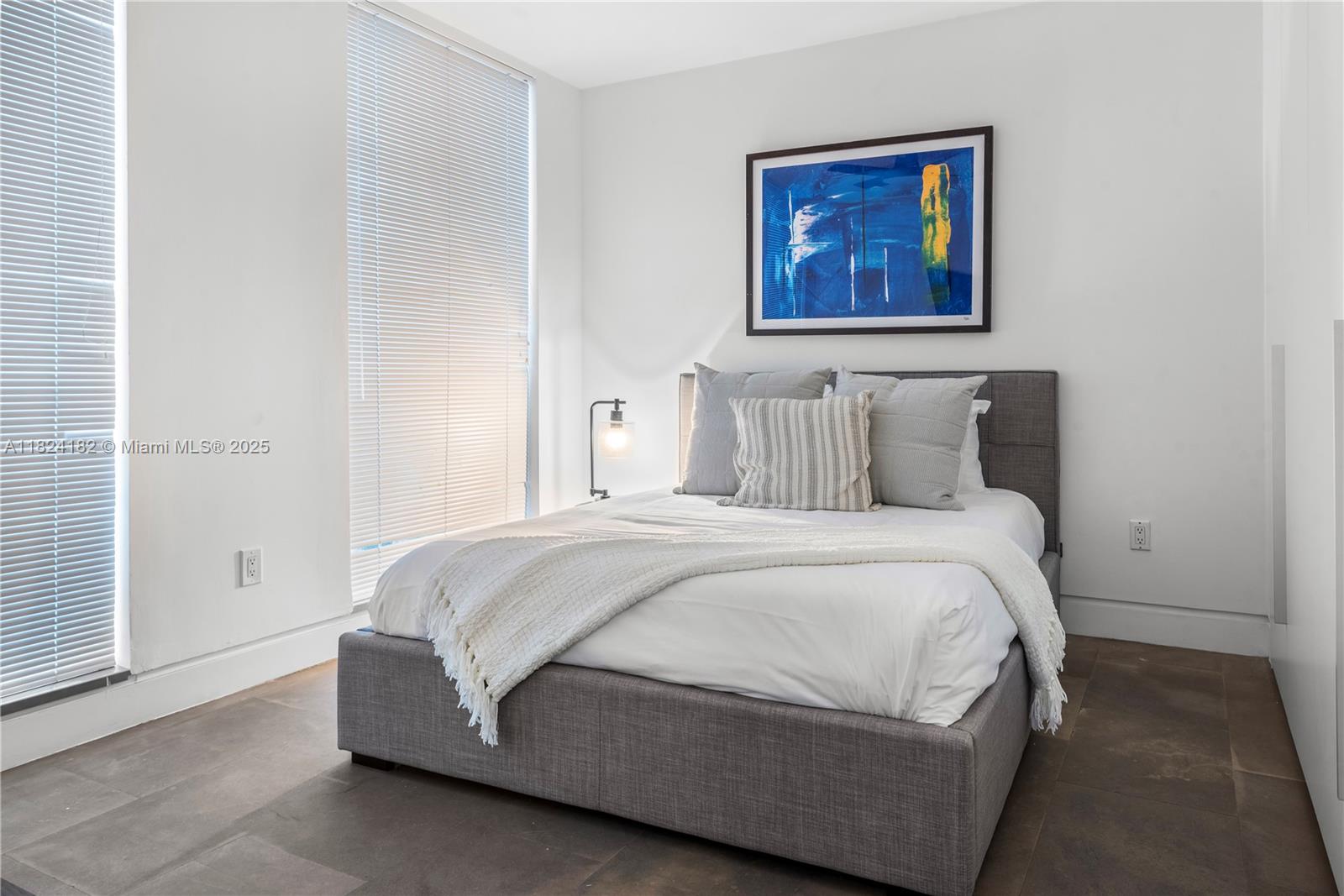 1606 South Bayshore Drive Miami, FL 33133 - Photo 33 of 54 a bedroom with a bed and painting on the wall