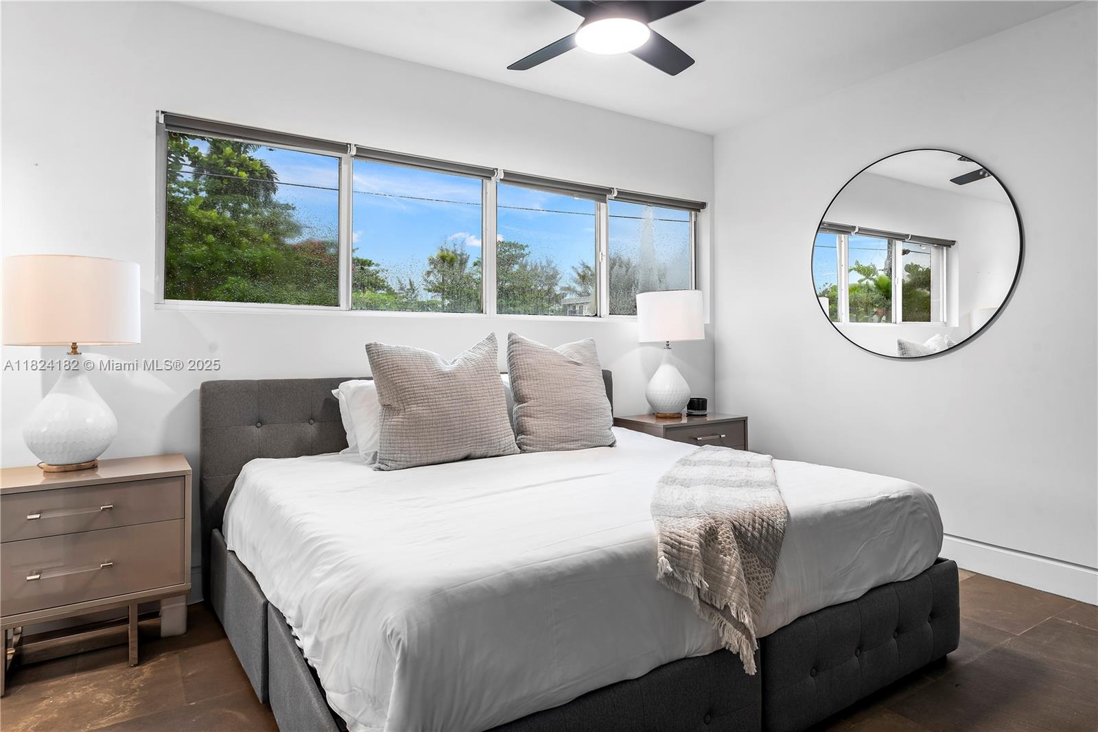 1606 South Bayshore Drive Miami, FL 33133 - Photo 37 of 54 a bedroom with a bed mirror and window