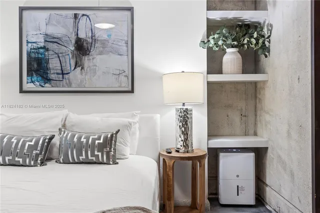 a view of a patio with table and chairs and potted plants