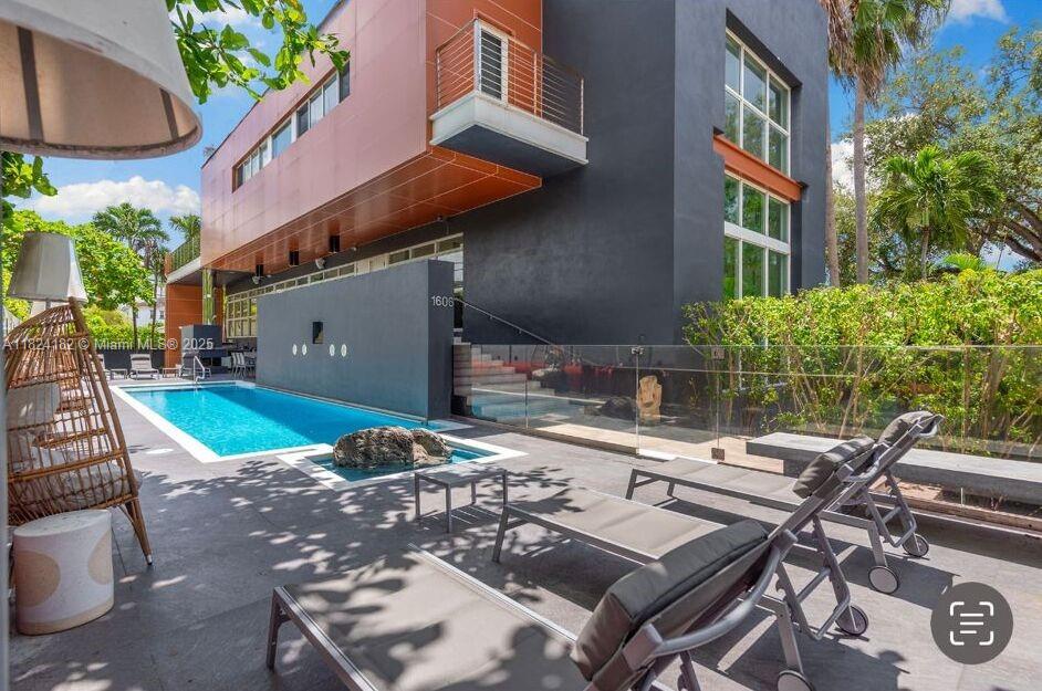 1606 South Bayshore Drive Miami, FL 33133 - Photo 50 of 54 a view of a patio with table and chairs and potted plants