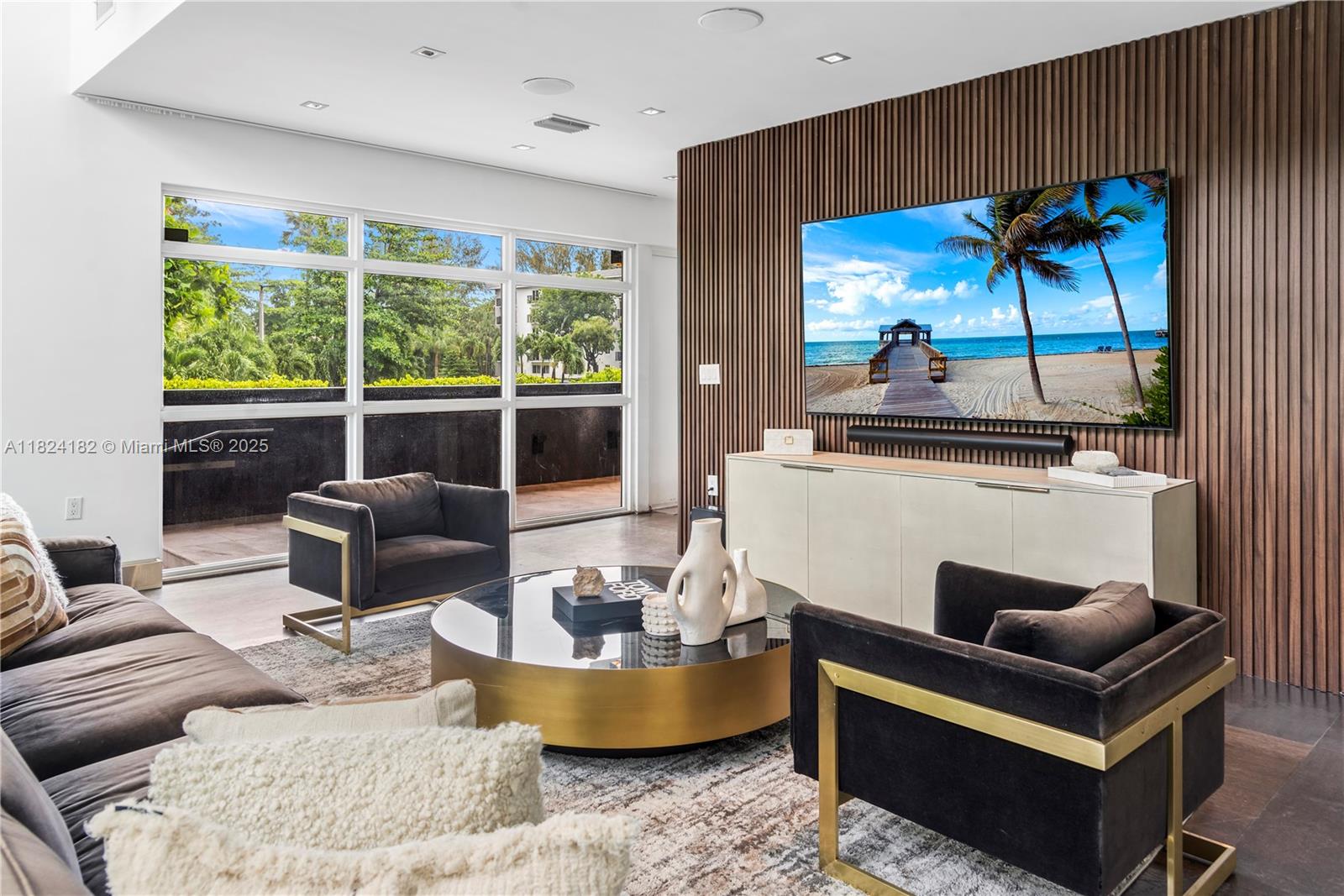 1606 South Bayshore Drive Miami, FL 33133 - Photo 5 of 54 a living room with furniture and a floor to ceiling window