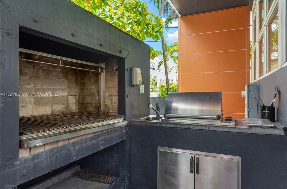 1606 South Bayshore Drive Miami, FL 33133 - Photo 52 of 54 a bathroom with a sink and a mirror