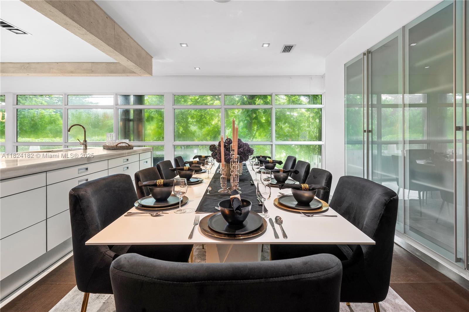 1606 South Bayshore Drive Miami, FL 33133 - Photo 6 of 54 a view of a dining room with furniture window and outside view