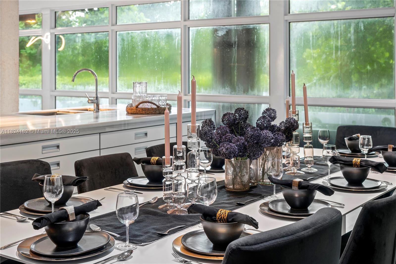 1606 South Bayshore Drive Miami, FL 33133 - Photo 8 of 54 a kitchen with a stove a sink and a table