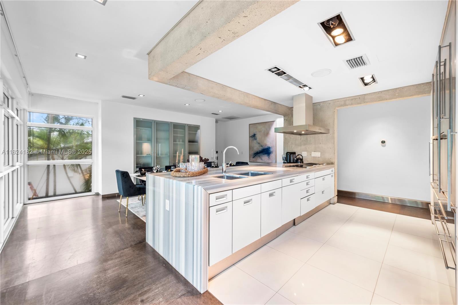 1606 South Bayshore Drive Miami, FL 33133 - Photo 9 of 54 a large white kitchen with a large window