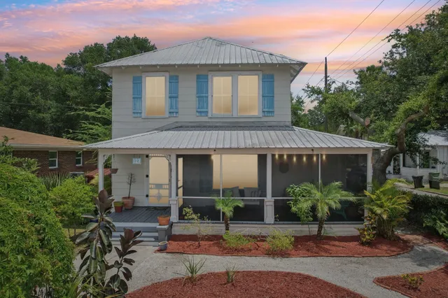 a large kitchen with a table and chairs
