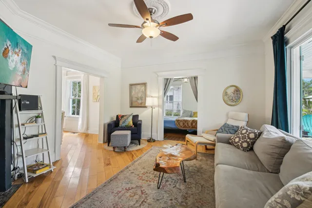 a view of a dining room with furniture window and wooden floor