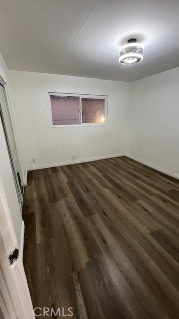 12950 5th Street, Unit 10 Chino, CA 91710 - Photo 5 of 11 a view of empty room with wooden floor