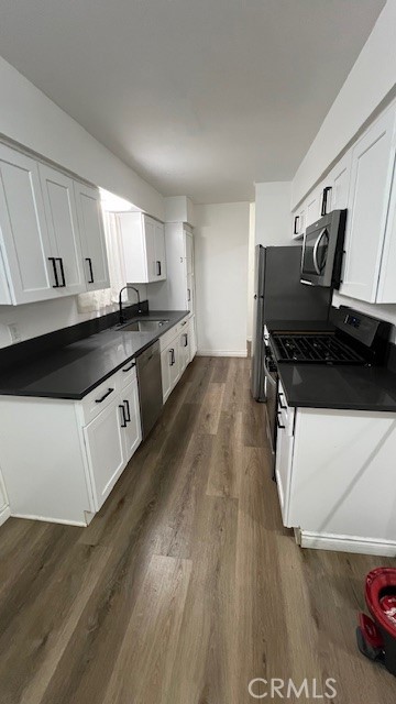 12950 5th Street, Unit 10 Chino, CA 91710 - Photo 7 of 11 a kitchen with stainless steel appliances a stove a sink and a refrigerator