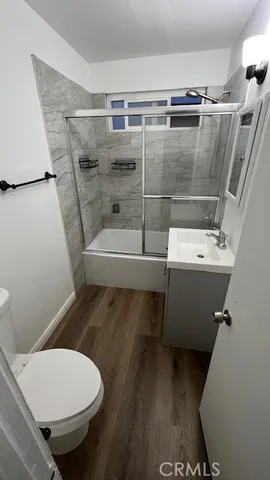 a bathroom with a toilet and a bathtub