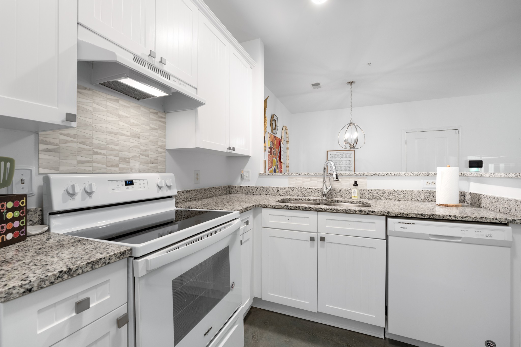 7219 Althorp Way, Unit L4 Nashville, TN 37211 - Photo 15 of 36 a kitchen with granite countertop a sink stainless steel appliances and white cabinets
