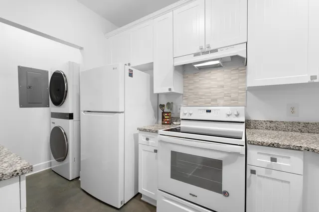 a kitchen with a stove and a refrigerator