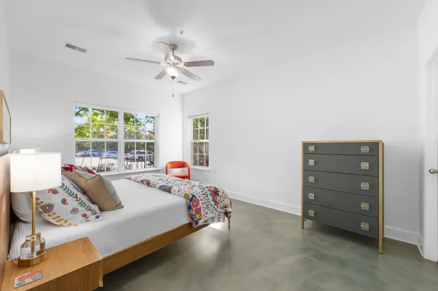 a bed room with a bed and a window