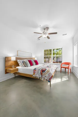 a bedroom with furniture and window