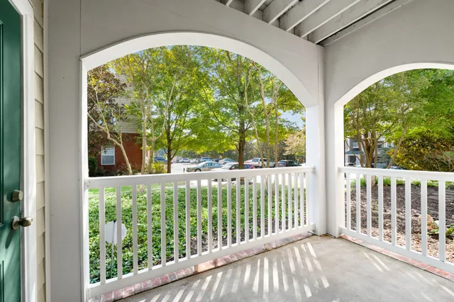 a view of a living room and a balcony
