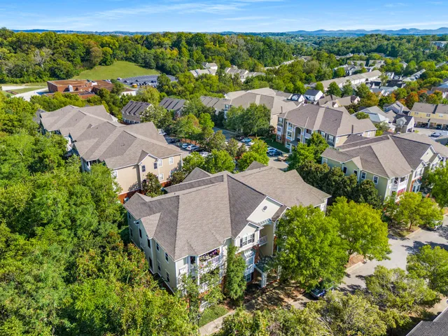 an aerial view of residential houses with outdoor space