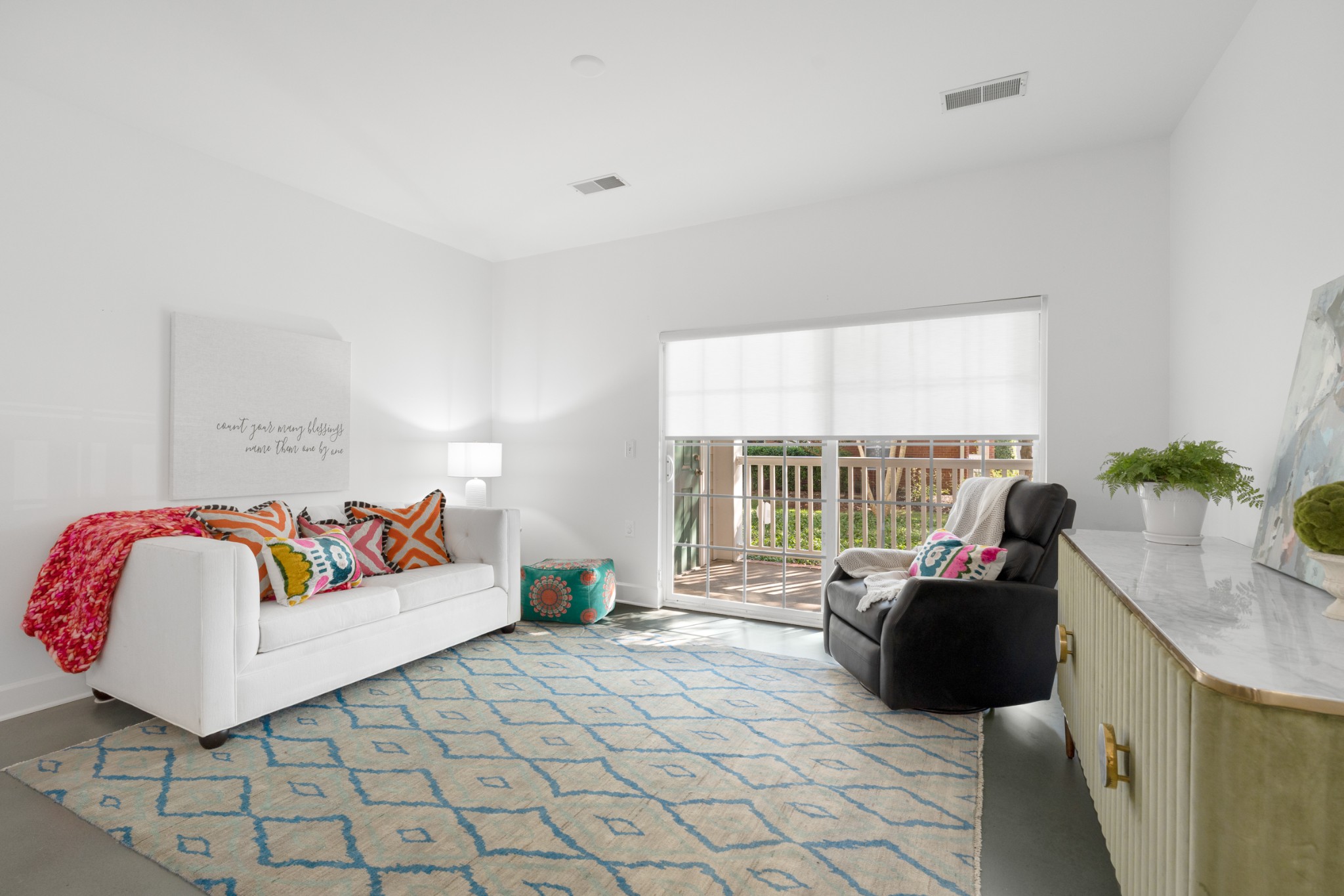7219 Althorp Way, Unit L4 Nashville, TN 37211 - Photo 5 of 36 a living room with furniture and a flat screen tv