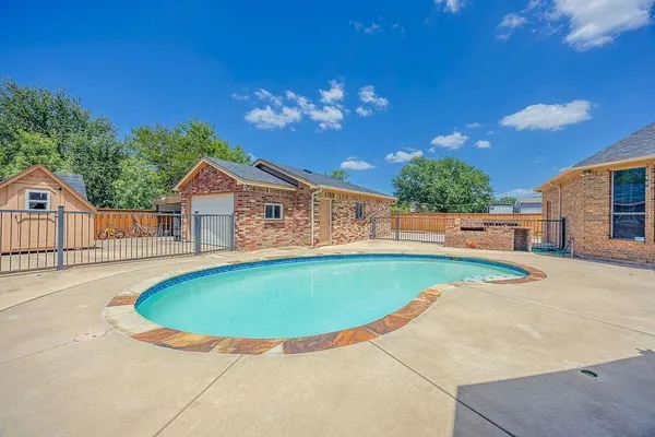 a view of outdoor space yard and swimming pool