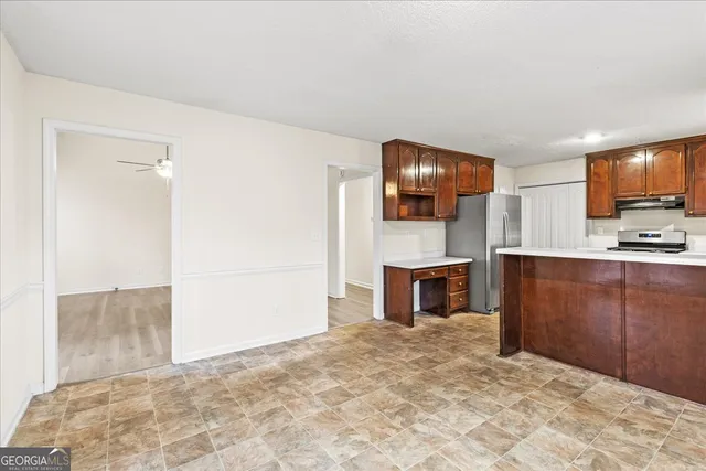 a view of living room with furniture and a fireplace