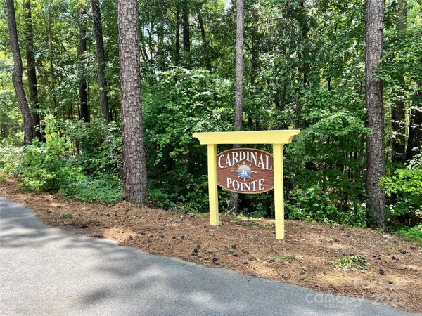 a sign board with a tree