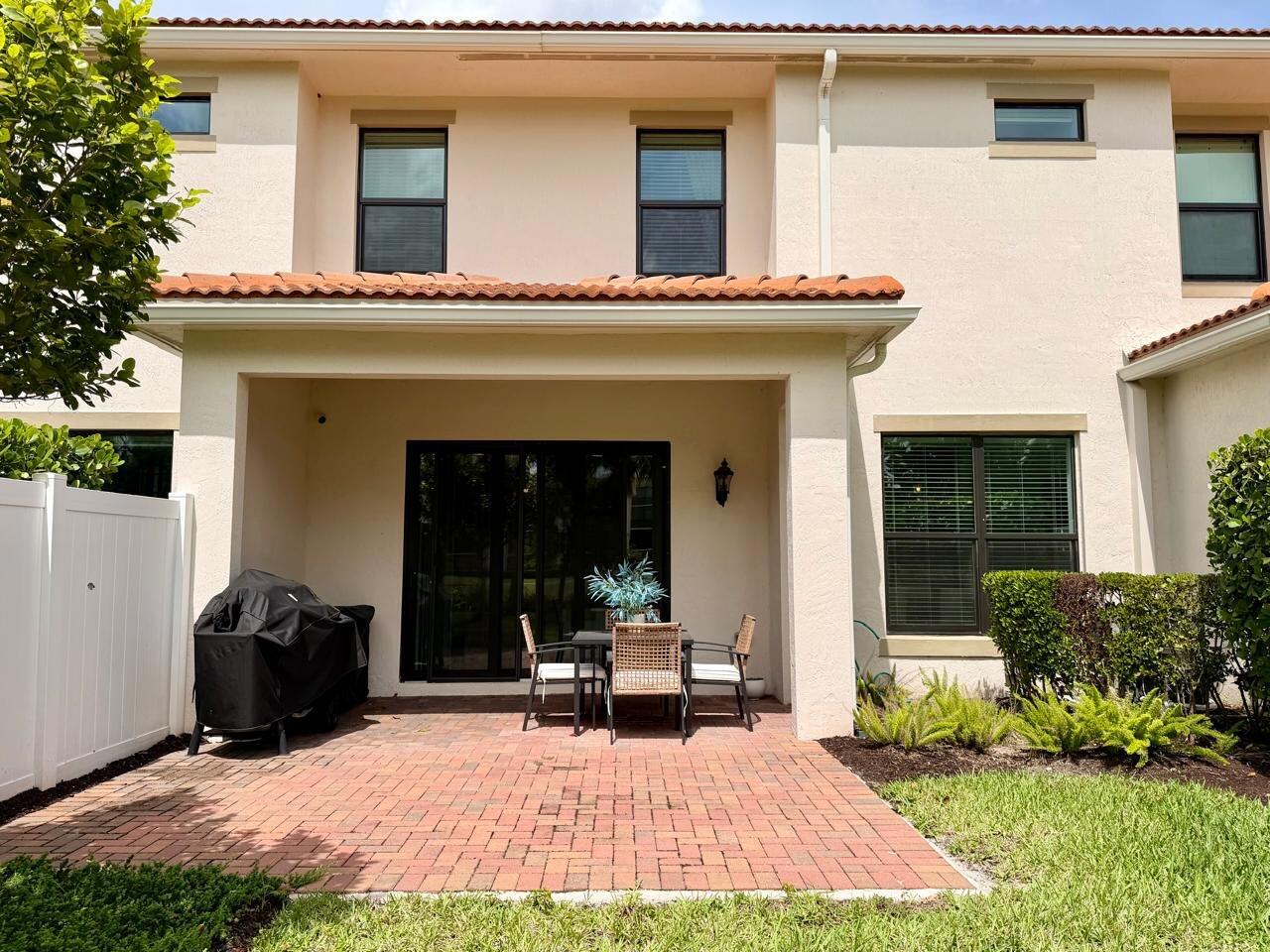 9420 Kinley Place Boca Raton, FL 33428 - Photo 16 of 17 a view of house with yard outdoor seating and barbeque oven