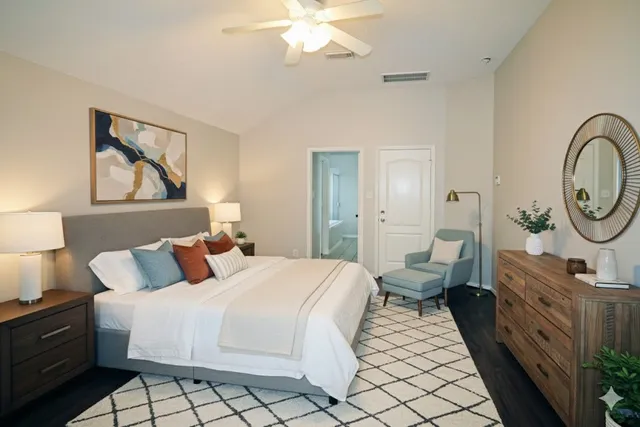 a bedroom with bed and a chandelier