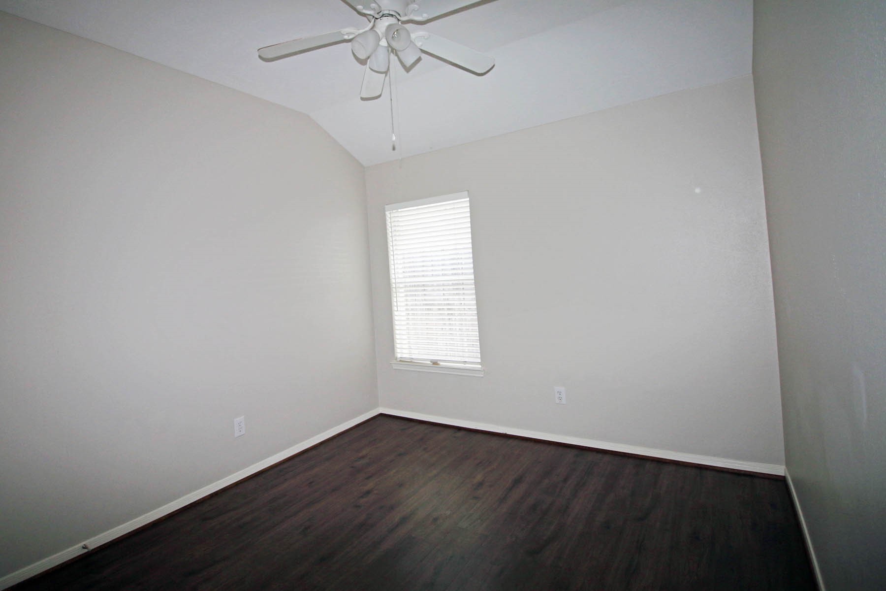 21743 May Apple Court Cypress, TX 77433 - Photo 7 of 15 an empty room with wooden floor and windows