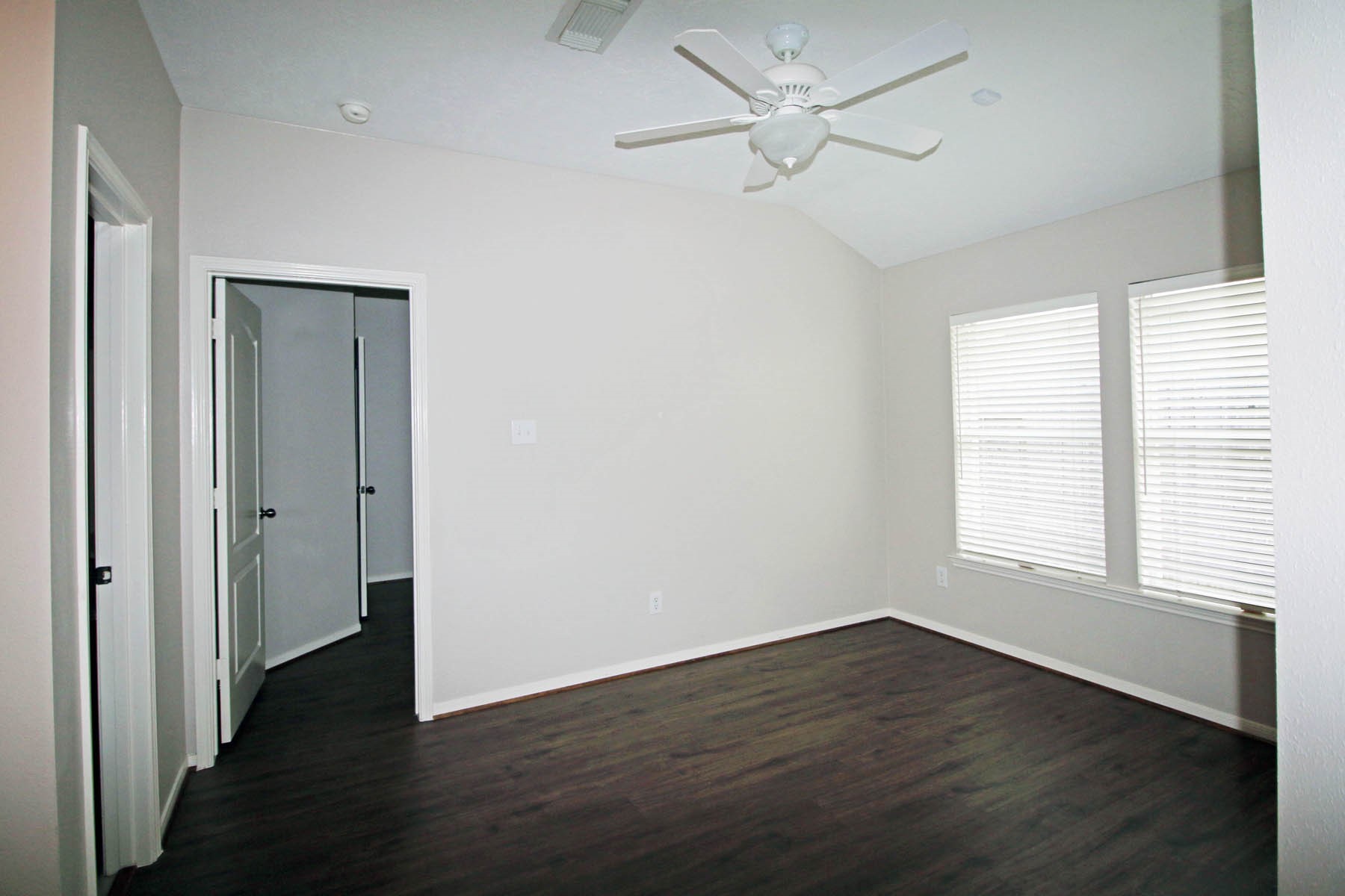 21743 May Apple Court Cypress, TX 77433 - Photo 8 of 15 a view of an empty room with wooden floor and a window