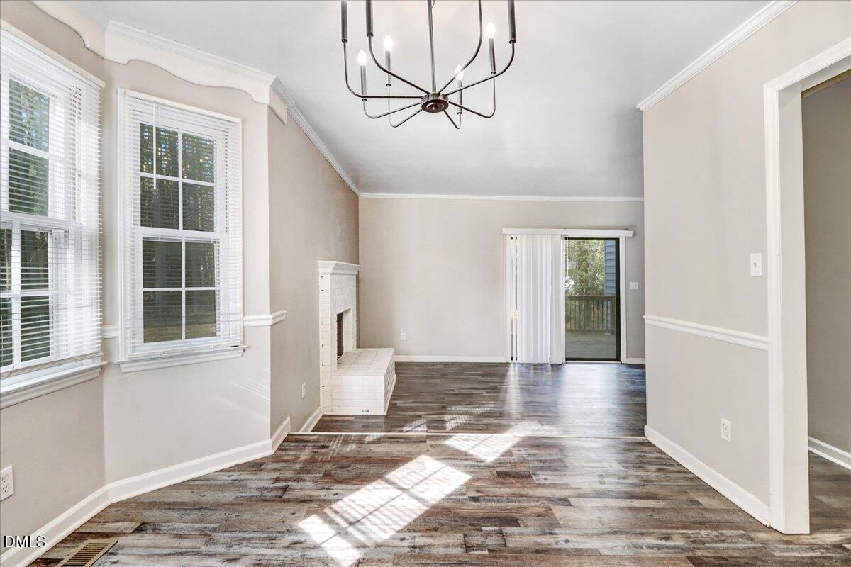 4715 Mallory Court Raleigh, NC 27616 - Photo 9 of 31 a view of empty room with windows