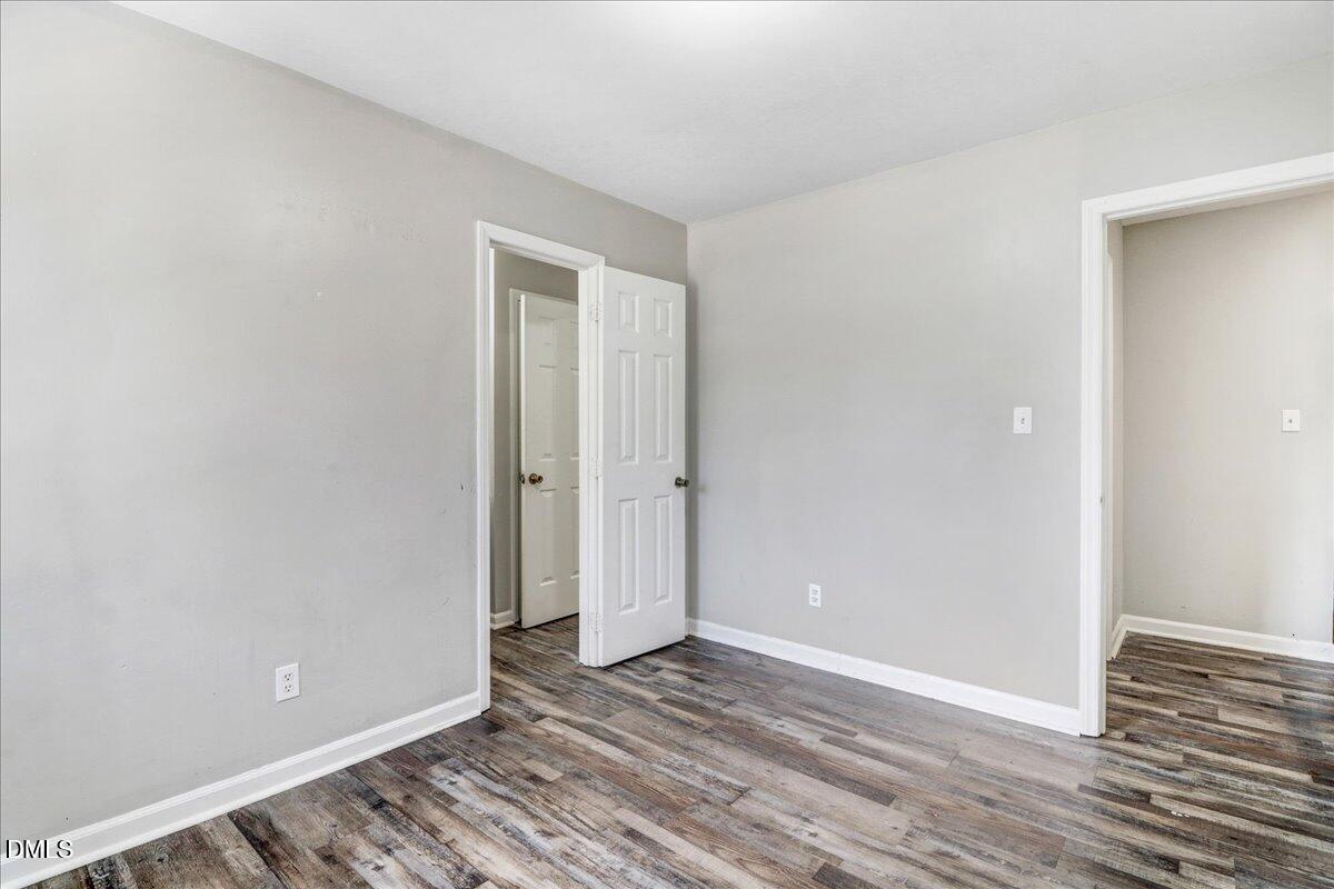 4715 Mallory Court Raleigh, NC 27616 - Photo 19 of 31 a view of a room with wooden floor