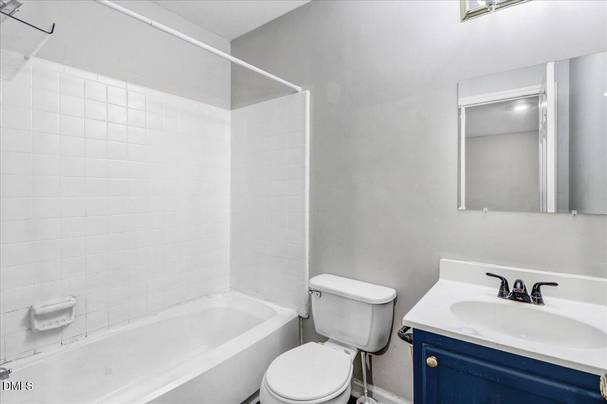 4715 Mallory Court Raleigh, NC 27616 - Photo 23 of 31 a bathroom with a sink toilet and shower