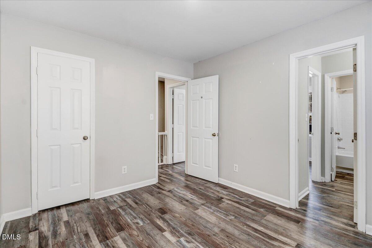 4715 Mallory Court Raleigh, NC 27616 - Photo 24 of 31 a view of an empty room with wooden floor and closet