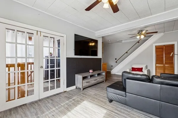 a living room with furniture and a flat screen tv
