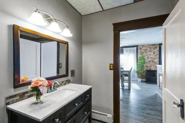 a bathroom with a sink and a mirror