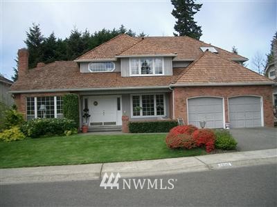 18617 136th Place Southeast Renton, WA 98058 - Photo 1 of 1 a front view of a house with a yard and garage
