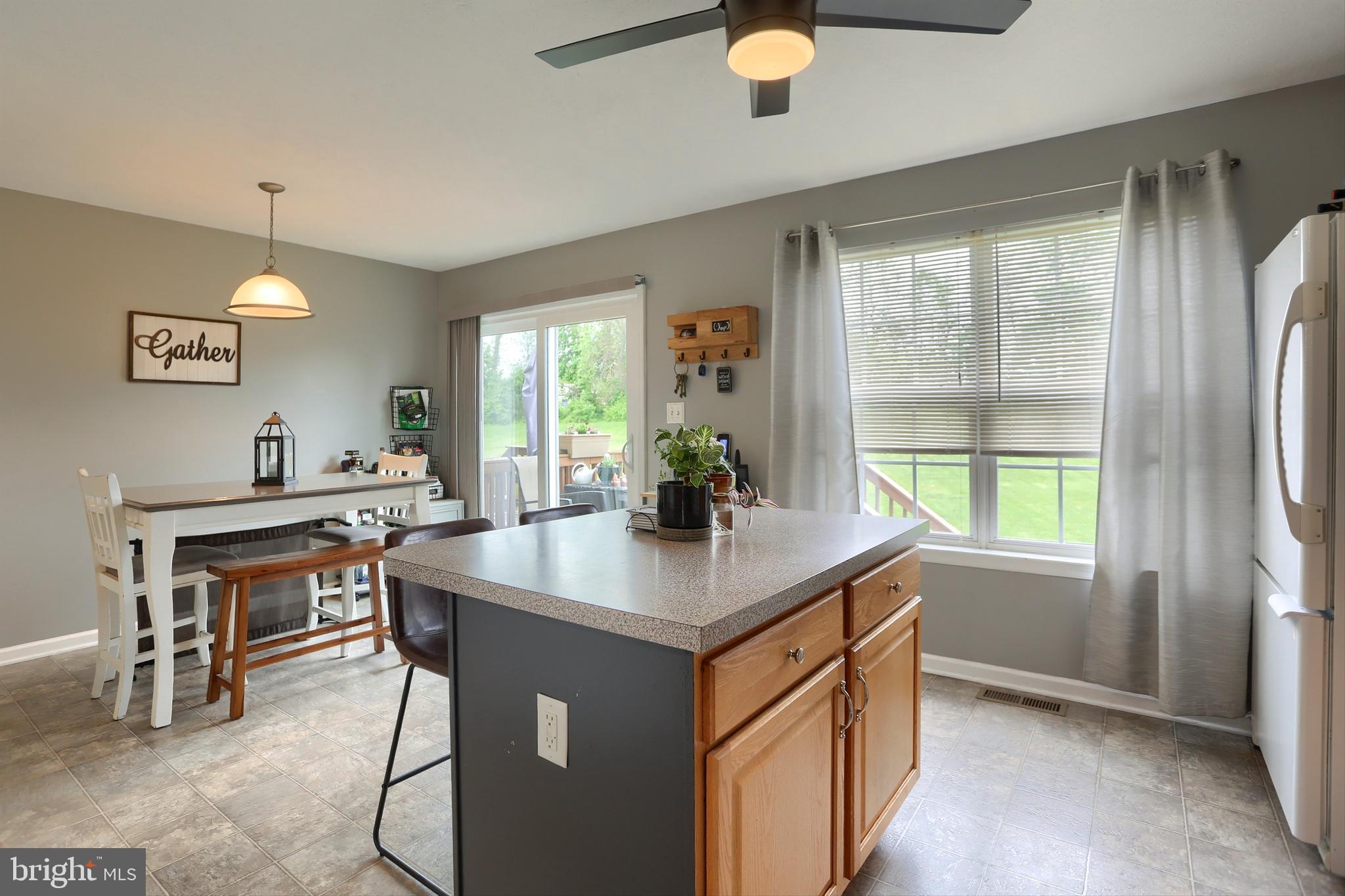 120 East Beaver Street York, PA 17406 - Photo 17 of 41 a view of kitchen island a sink windows and chairs