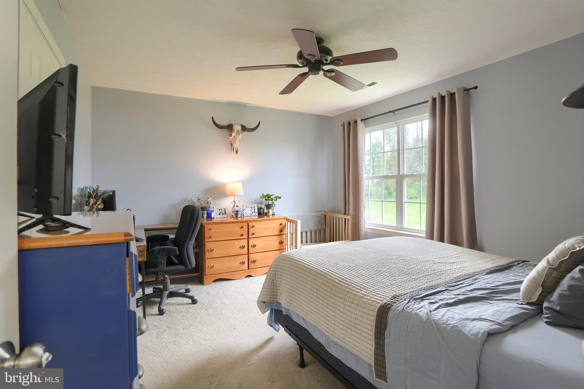 120 East Beaver Street York, PA 17406 - Photo 22 of 41 a bedroom with a bed and a desk