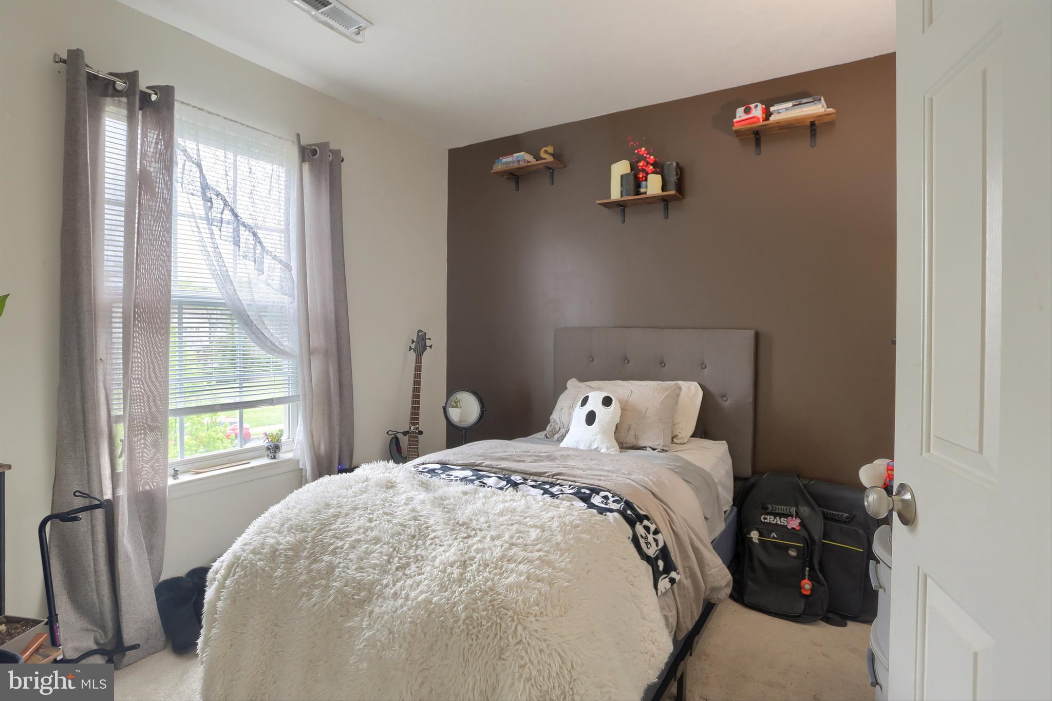 120 East Beaver Street York, PA 17406 - Photo 29 of 41 a bedroom with a bed and a window