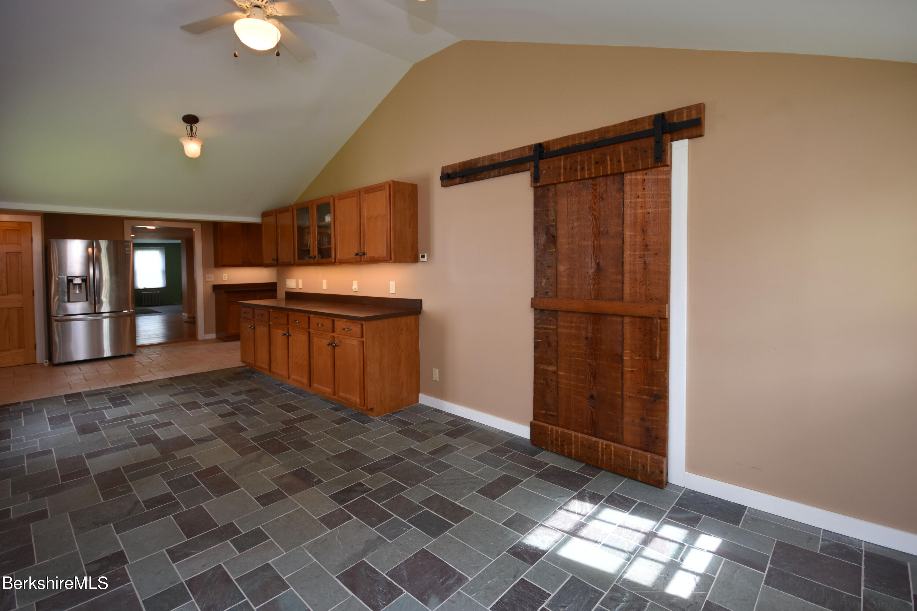 110 Tyringham Road Lee, MA 01238 - Photo 14 of 60 a view of kitchen with granite countertop cabinets and refrigerator
