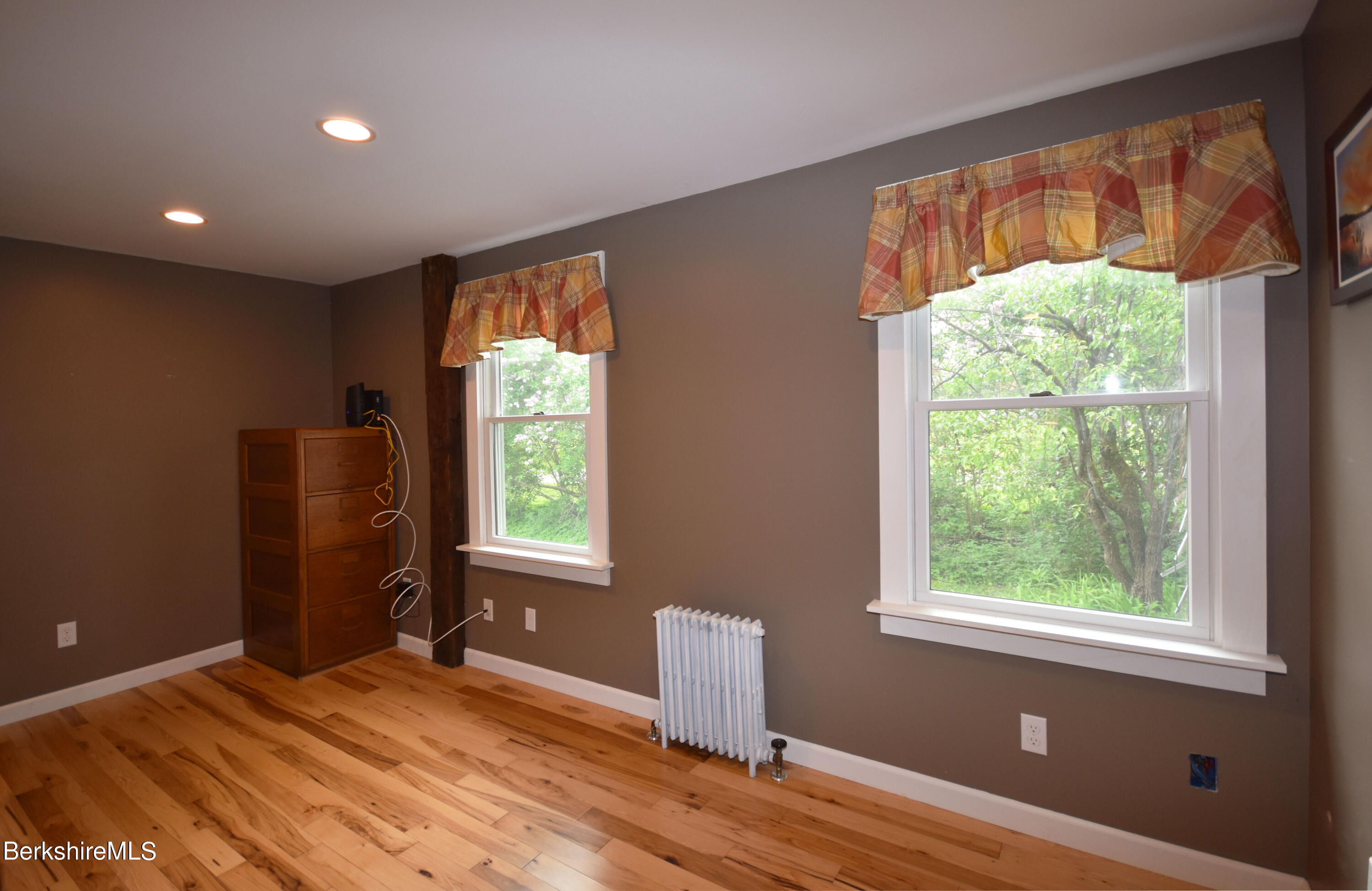 110 Tyringham Road Lee, MA 01238 - Photo 20 of 60 a bedroom with a window and a bed