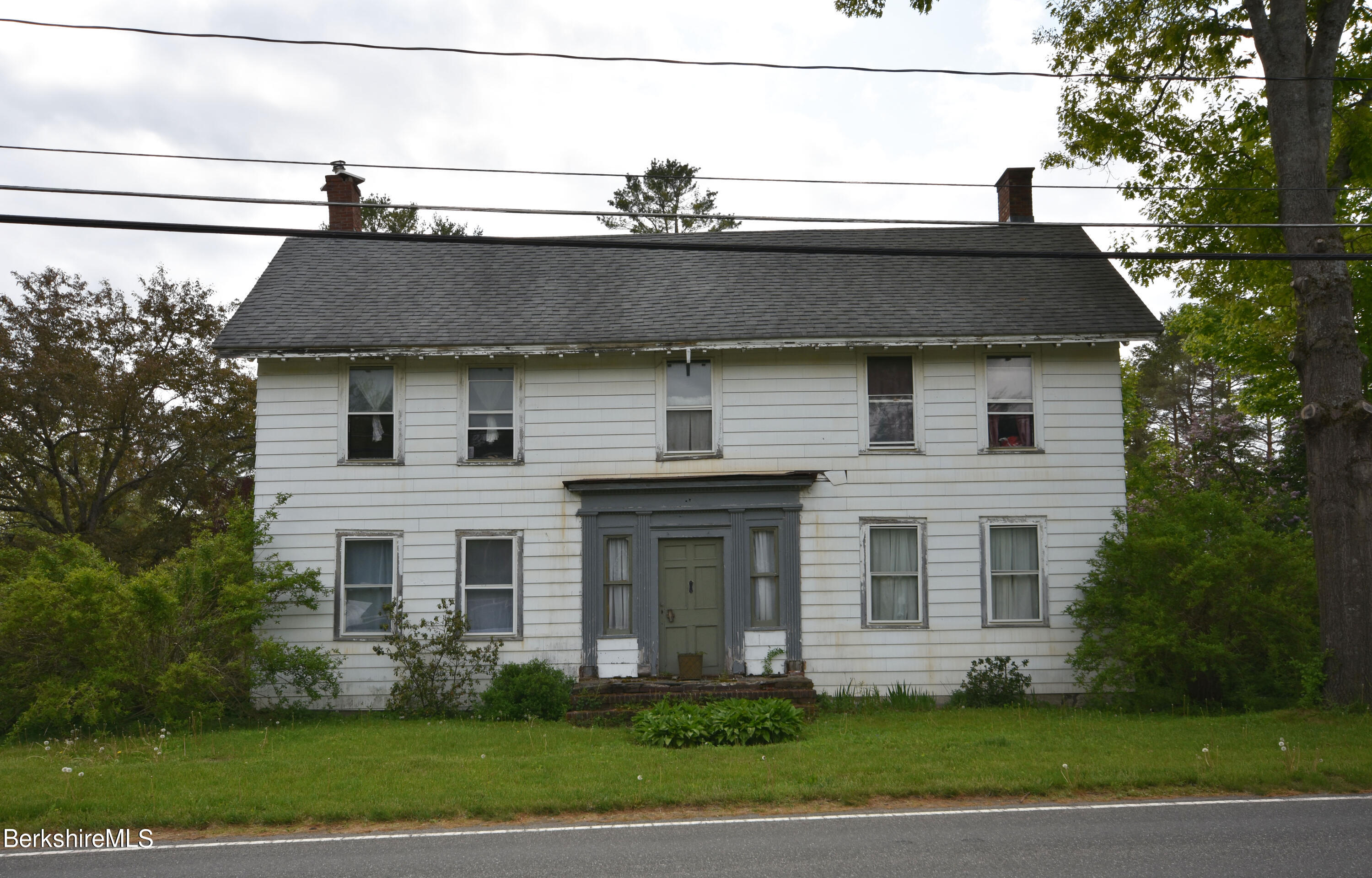 110 Tyringham Road Lee, MA 01238 - Photo 2 of 60 a front view of a house with a yard