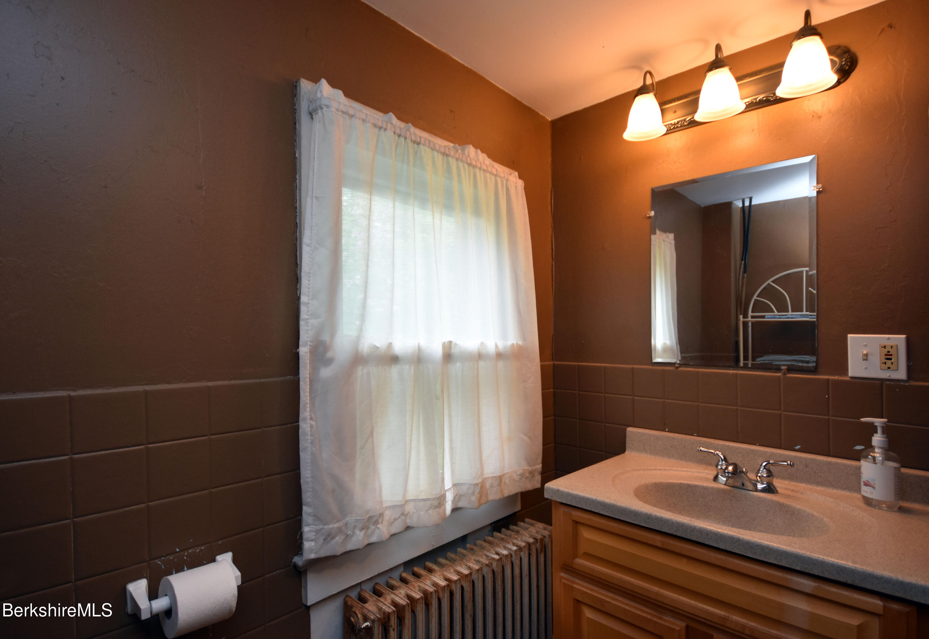 110 Tyringham Road Lee, MA 01238 - Photo 22 of 60 a bathroom with a sink and a mirror