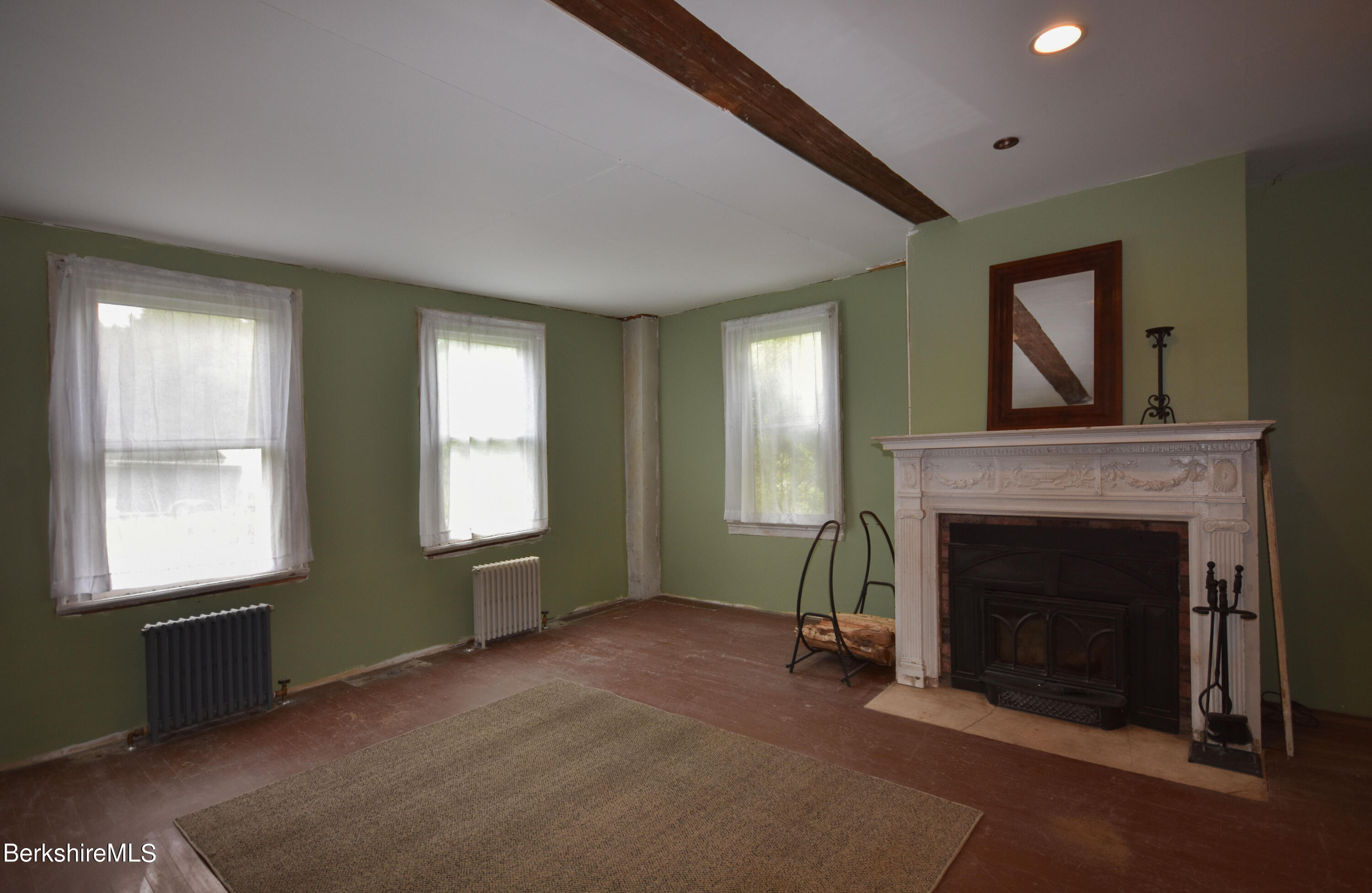 110 Tyringham Road Lee, MA 01238 - Photo 26 of 60 a view of an empty room with window and fire place