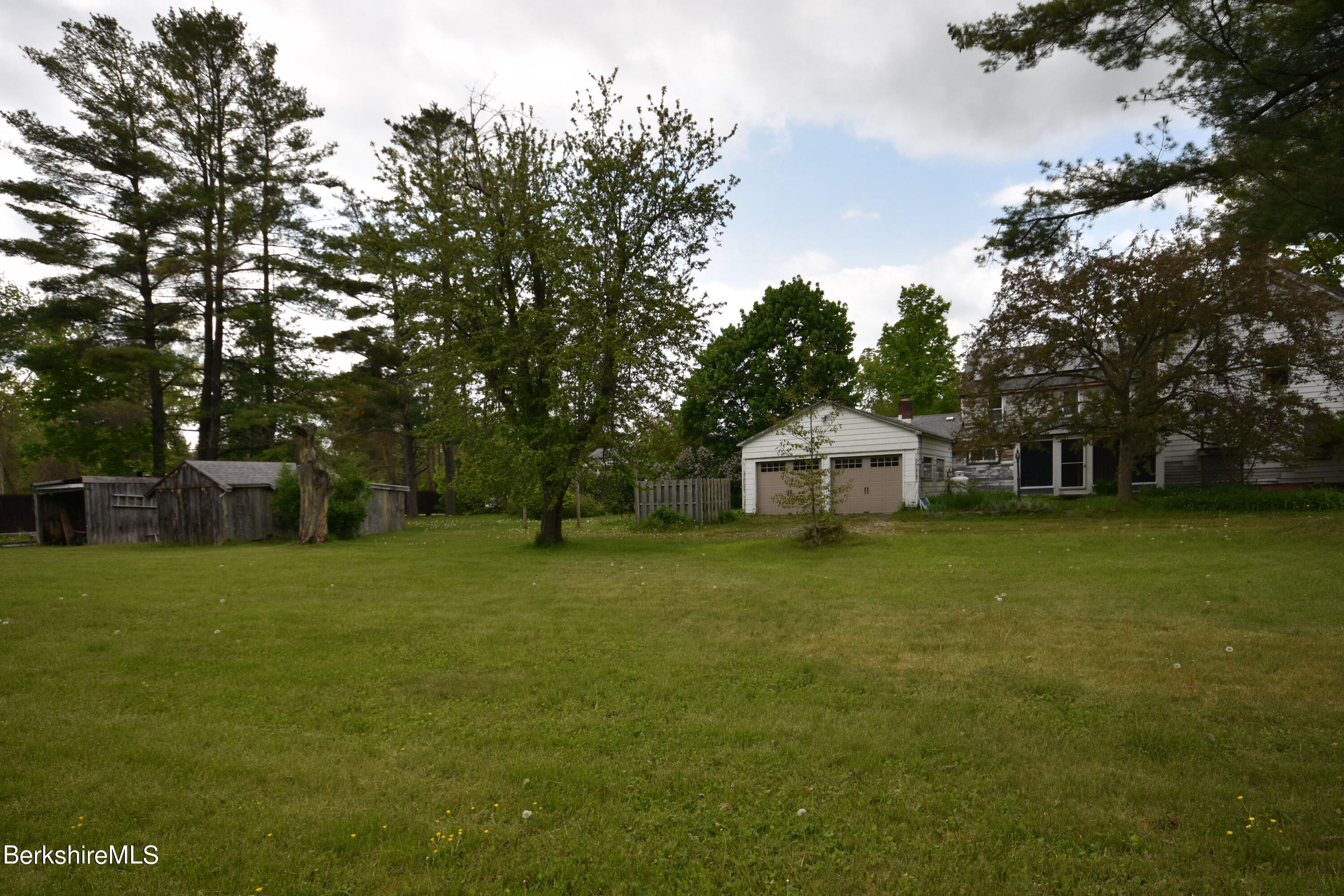 110 Tyringham Road Lee, MA 01238 - Photo 3 of 60 a front view of a house with a garden