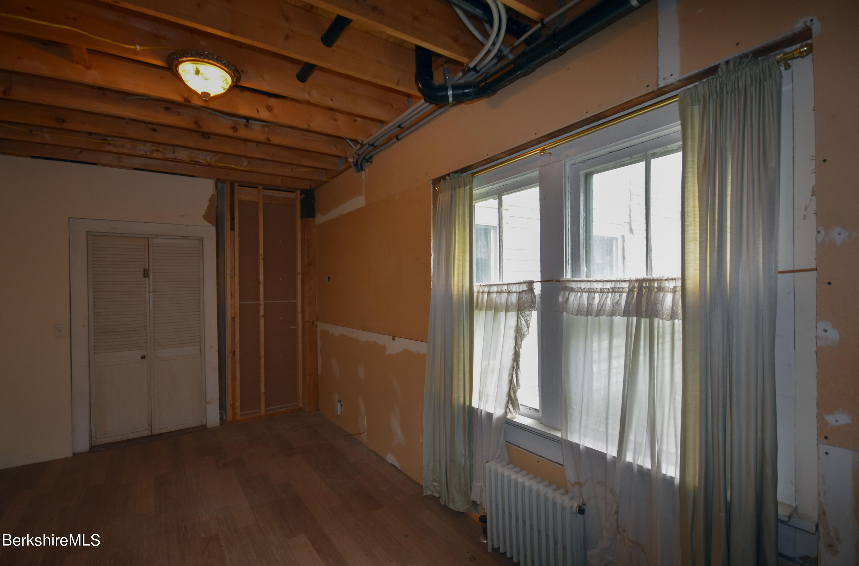 110 Tyringham Road Lee, MA 01238 - Photo 40 of 60 a view of empty room with wooden floor