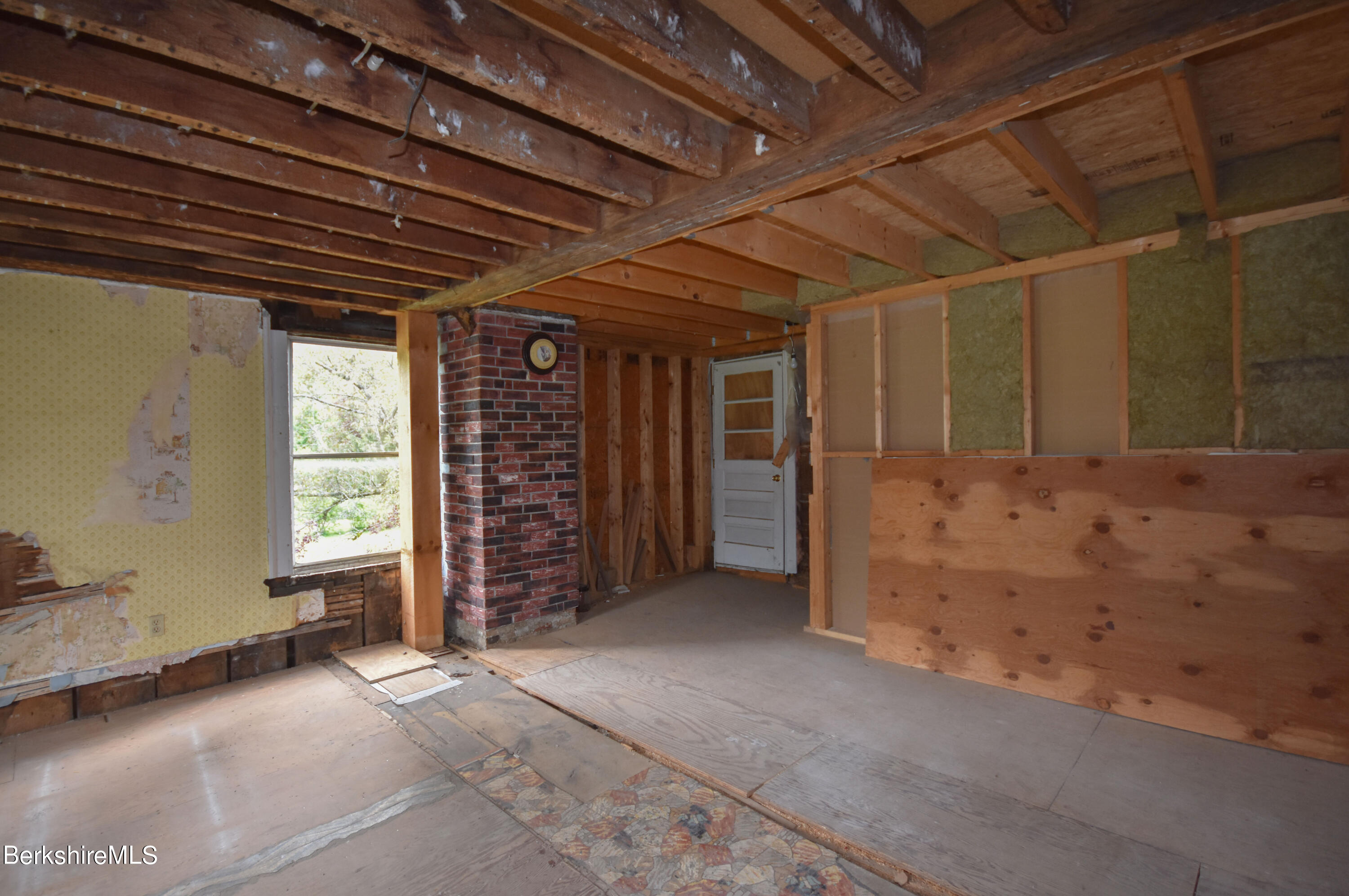 110 Tyringham Road Lee, MA 01238 - Photo 44 of 60 a view of empty room with wooden floor and a window