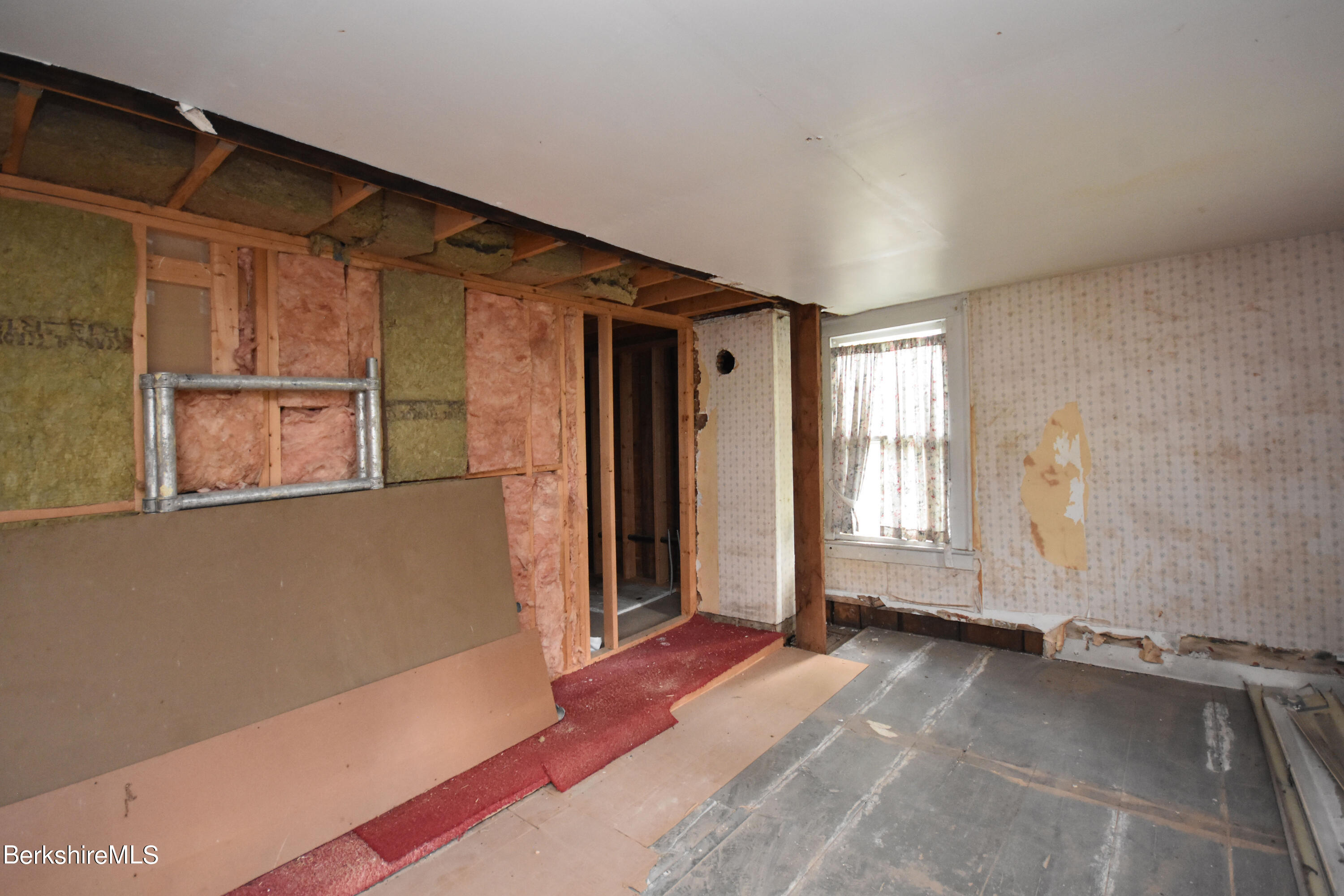 110 Tyringham Road Lee, MA 01238 - Photo 46 of 60 a view of empty room with wooden floor and fan