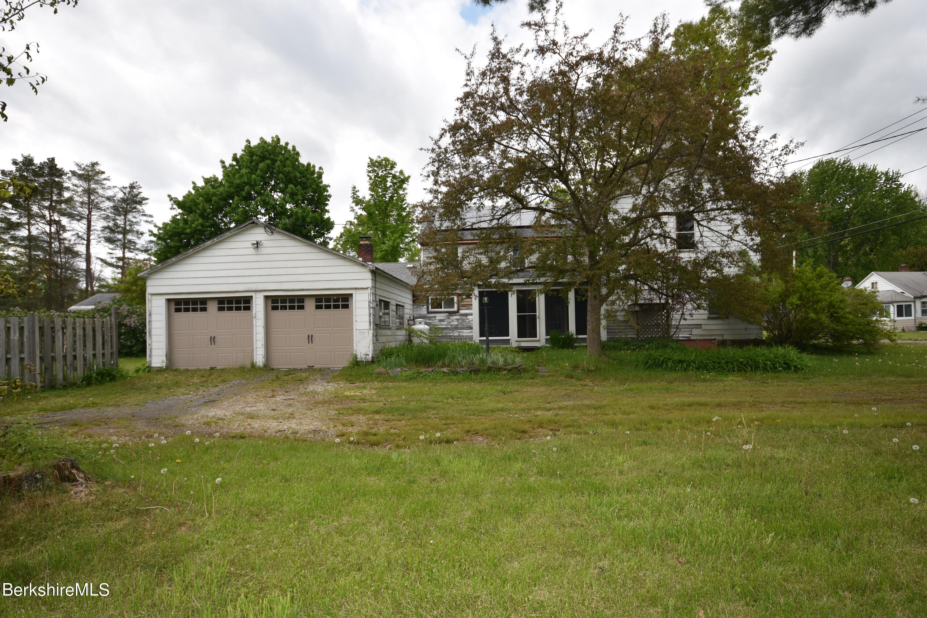 110 Tyringham Road Lee, MA 01238 - Photo 50 of 60 a front view of a house with a garden